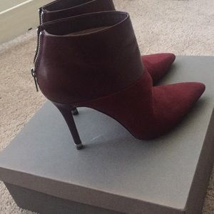 Micheal Kors red bottom booties.